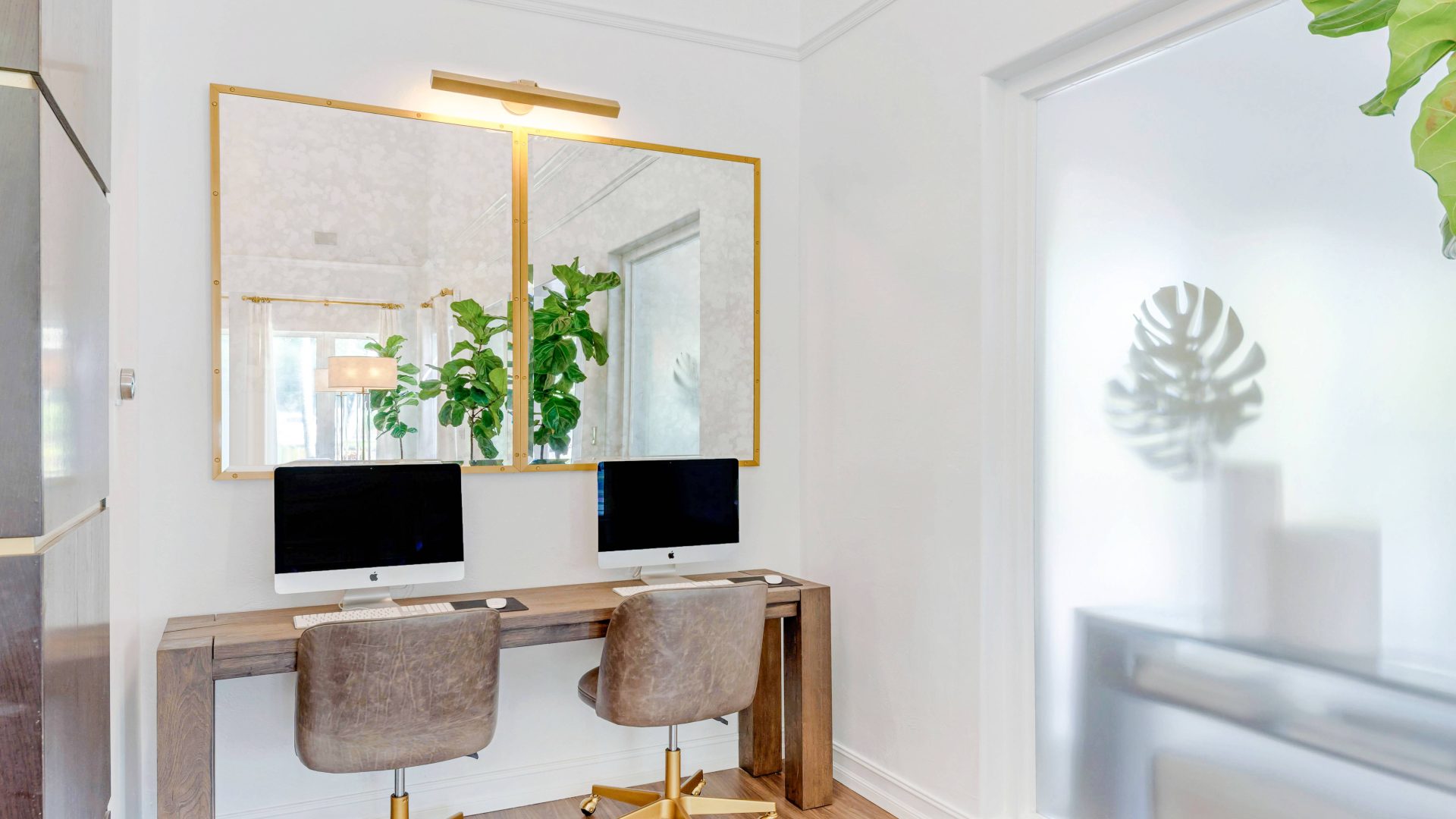 a home office with a desk and two chairs at The Palm Haven