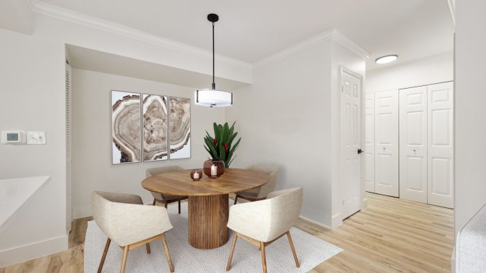 a dining room with a table and chairs at The Palm Haven