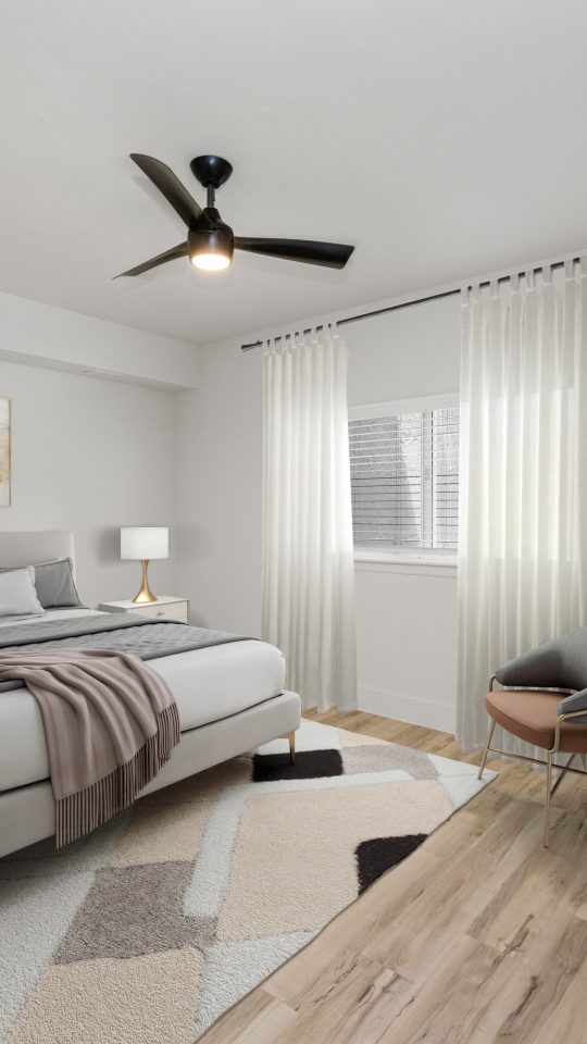 a rendering of a bedroom with a bed and a fan at The Palm Haven